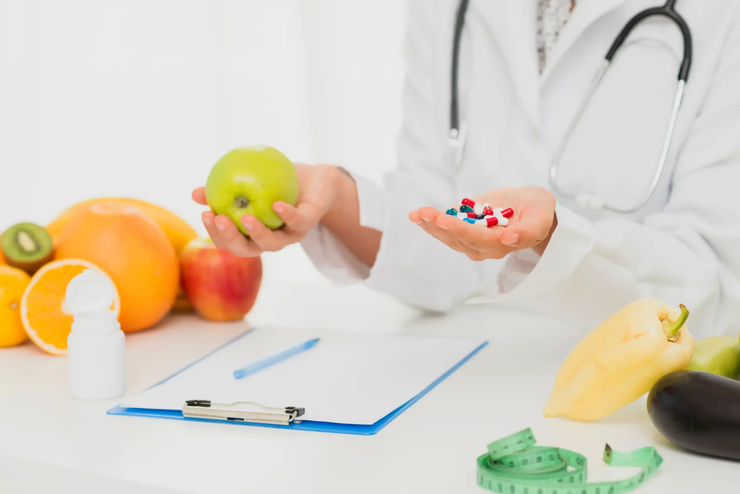 close up doctor with pills fresh fruits scaled