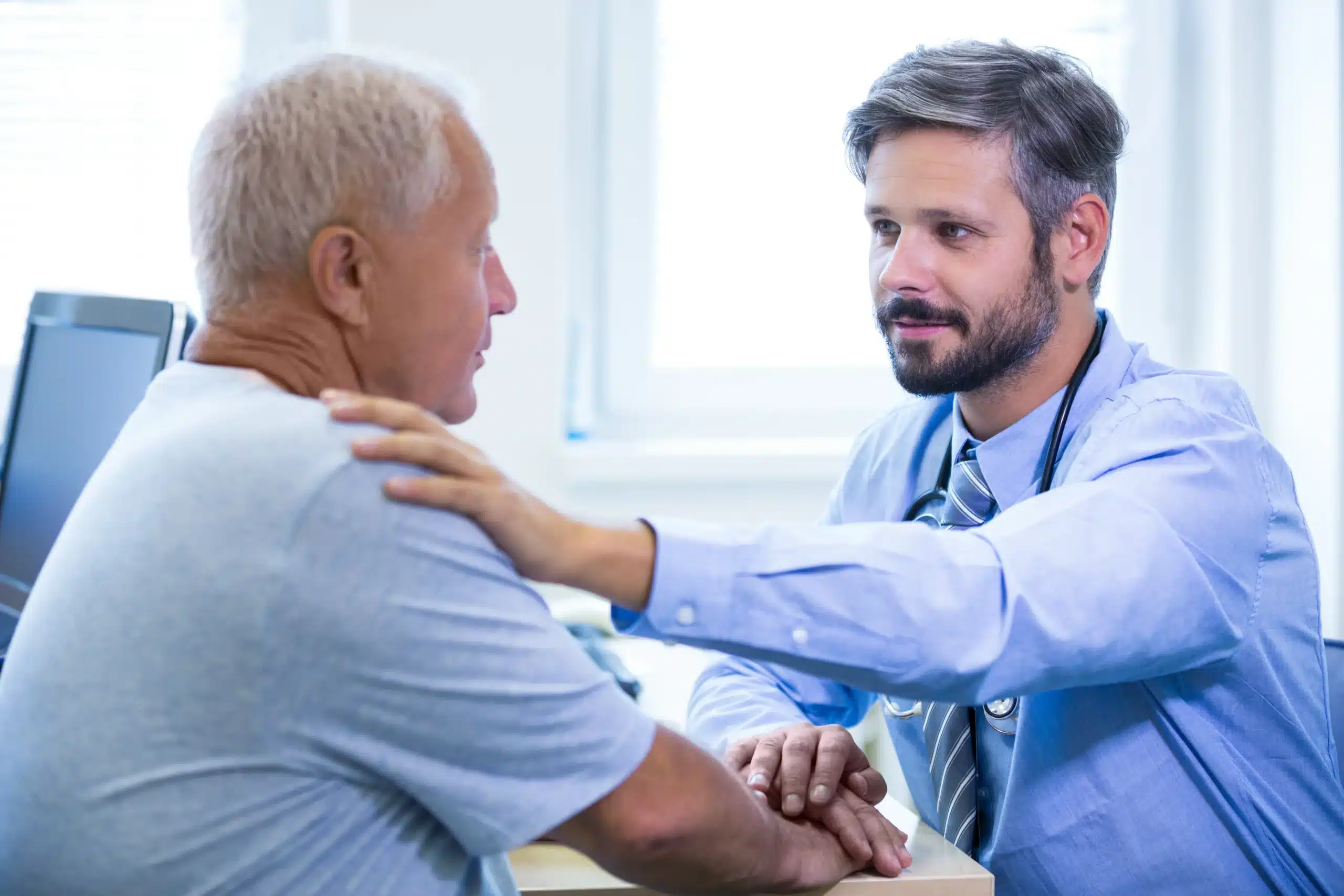 male doctor examining patient scaled