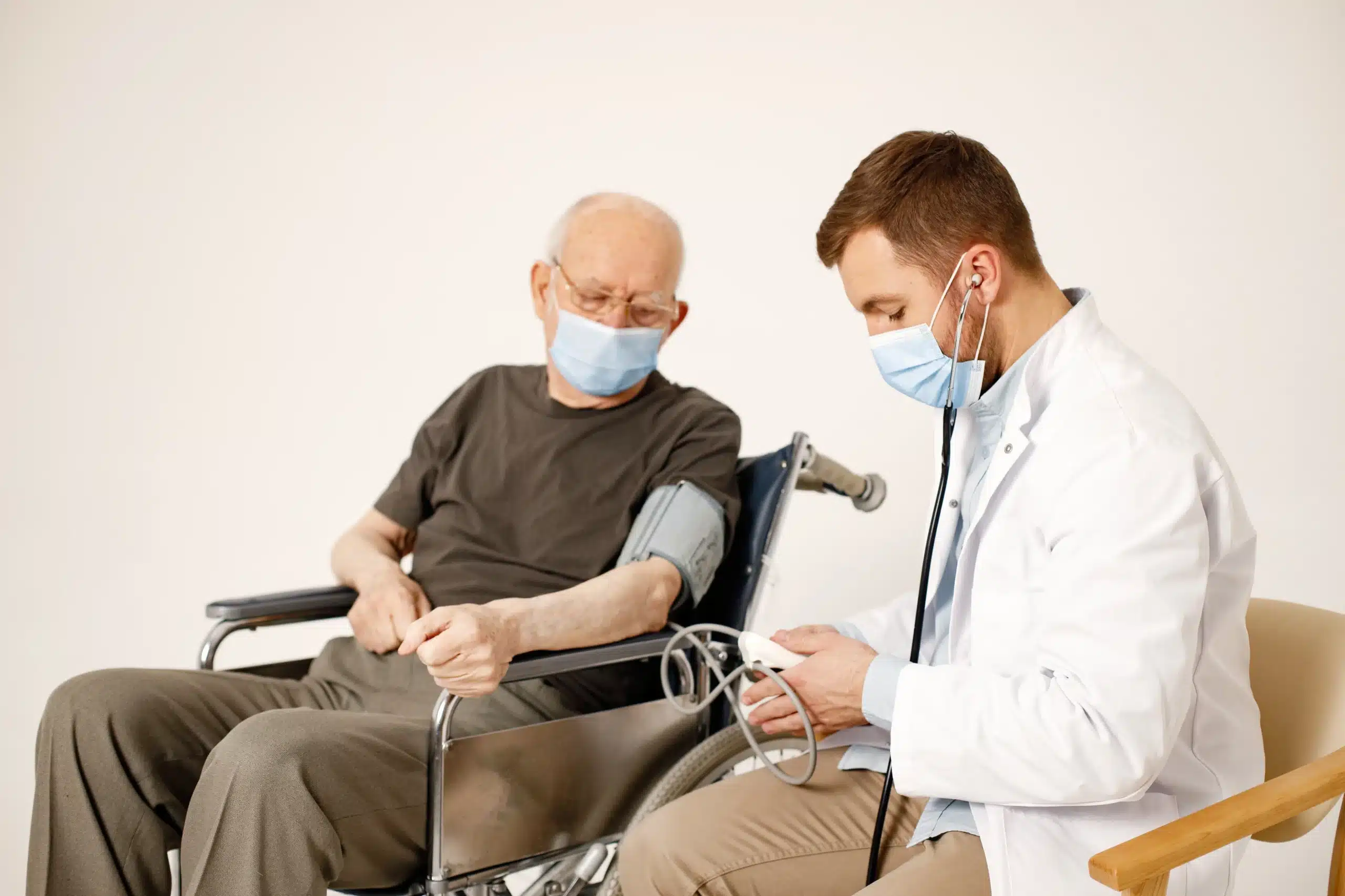 male doctor old man wheelchair isolated white background scaled