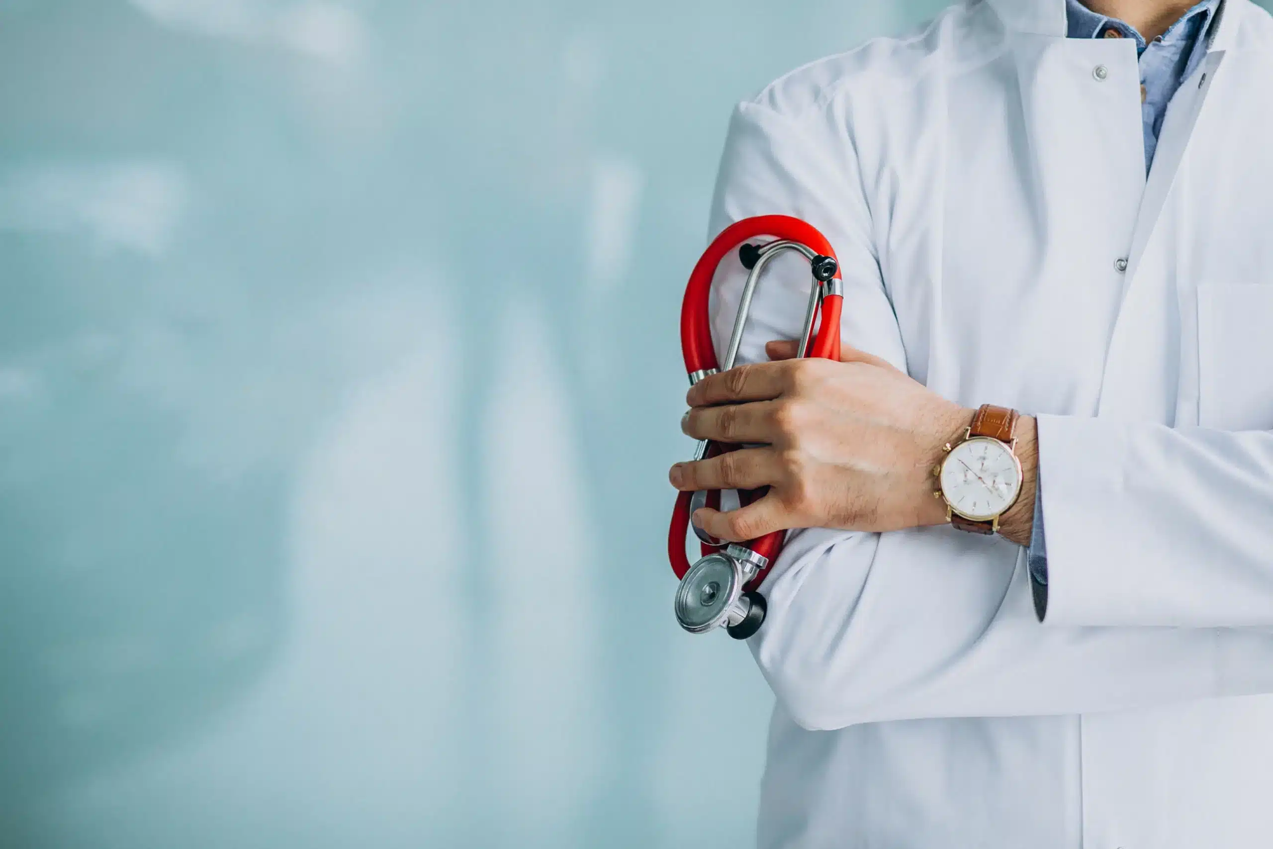 young handsome physician medical robe with stethoscope scaled